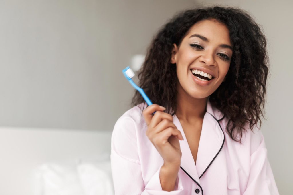 Lady With Toothbrush At Boyle Dental Rutherglen